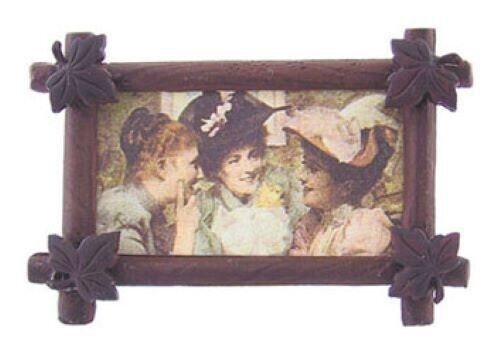 Dollhouse miniature before red hats in antique leaf frame, handcrafted