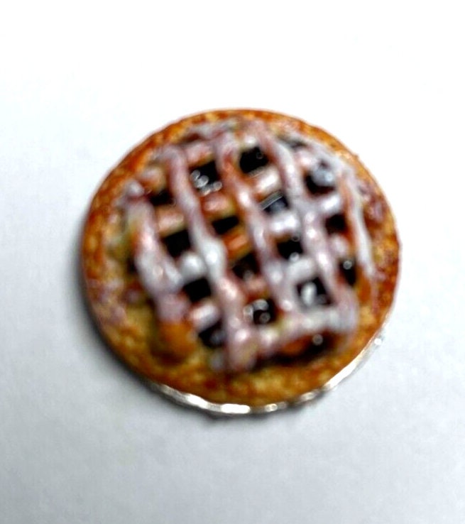 Dollhouse miniature apple pie on metal plate